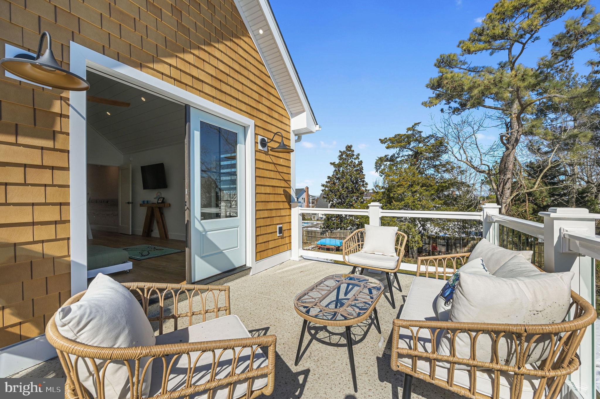 103 A New Road Lewes, DE 19958 - Photo 31 of 31 2nd floor,custom glass railings. A Dream come true