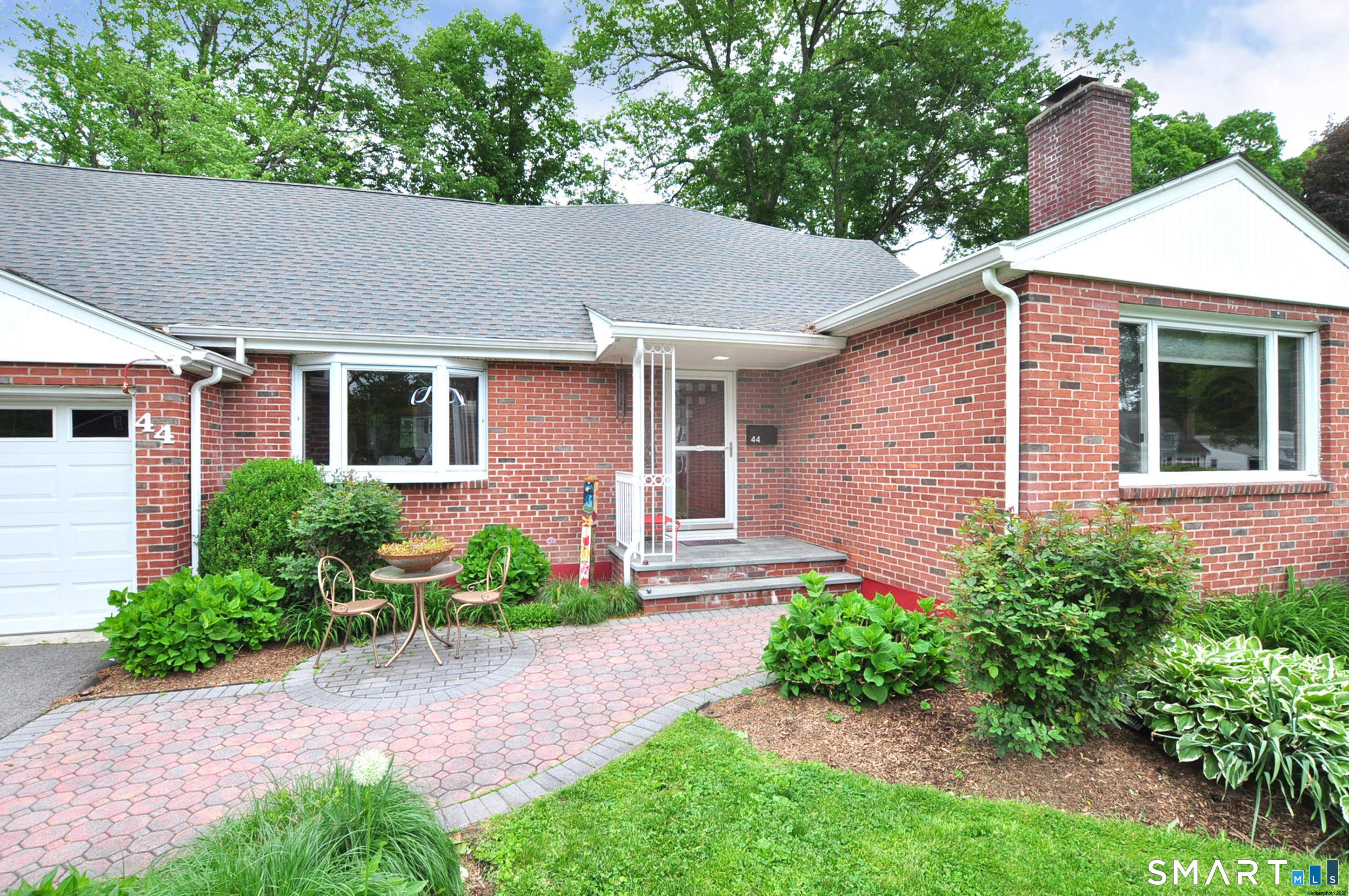 44 Miamis Road West Hartford, CT 06117 - Photo 2 of 39 a front view of a house with garden
