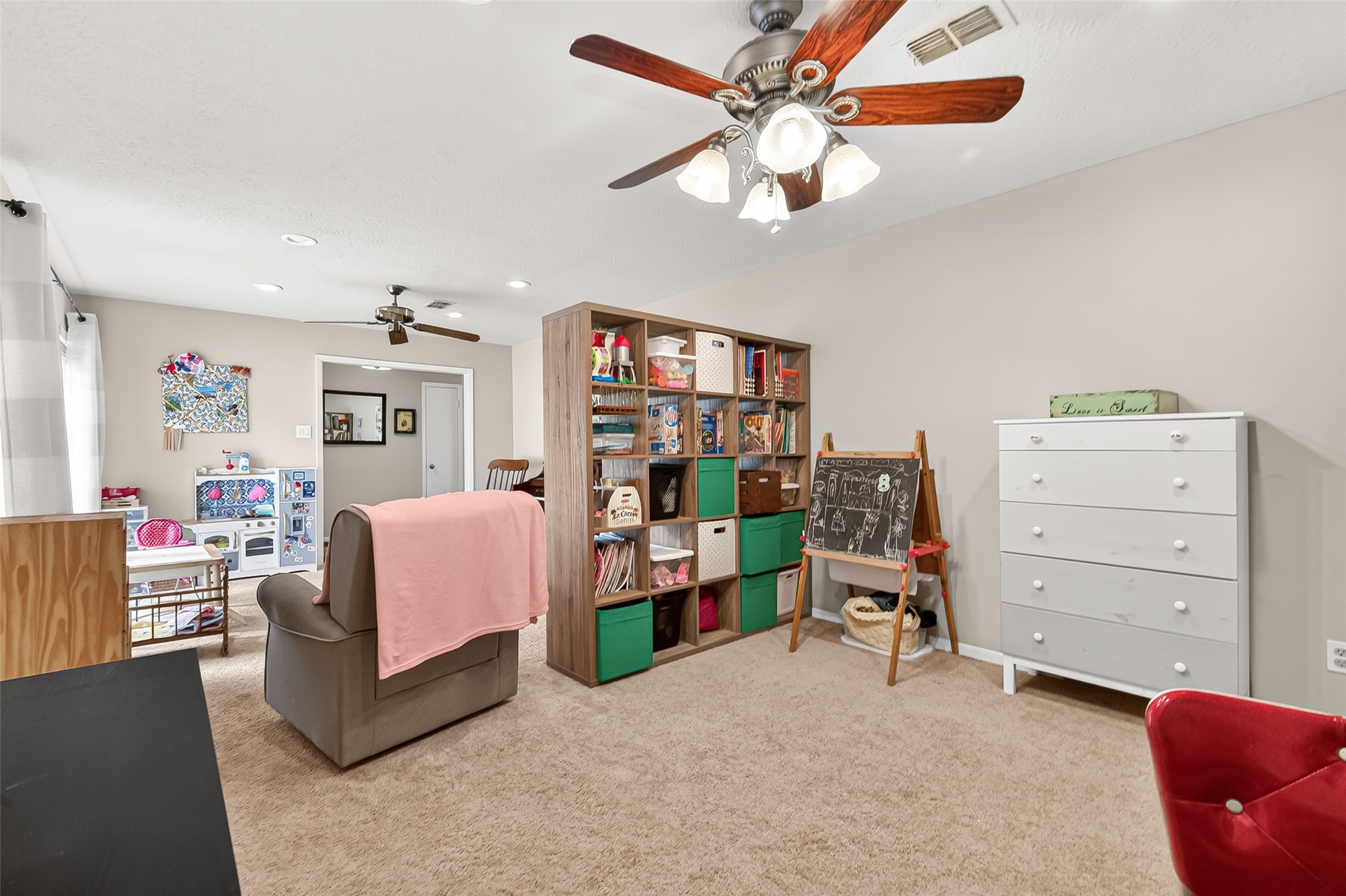 17611 Sorrell Ridge Drive Spring, TX 77388 - Photo 12 of 50 a living room with furniture and a dresser