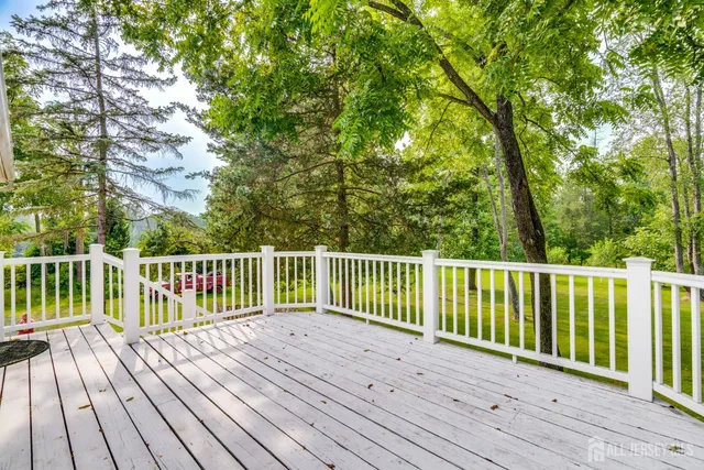 a view of a swimming pool with an outdoor space and seating area