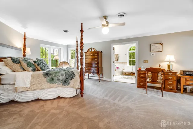 a bathroom with a shower and a glass door