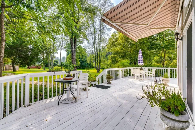 a view of a house with pool and garden