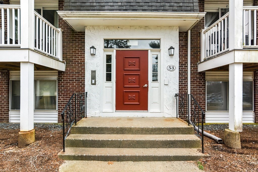 53 Will Drive, Unit 140 Canton, MA 02021 - Photo 18 of 22 a front view of a house with a gate