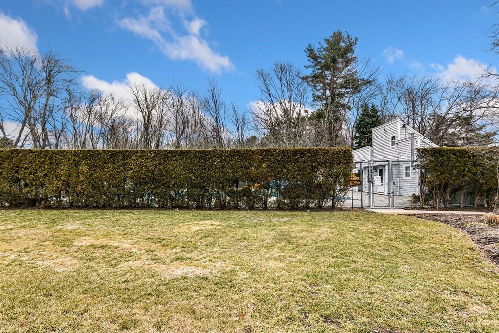 53 Will Drive, Unit 140 Canton, MA 02021 - Photo 19 of 22 a view of a house with a yard