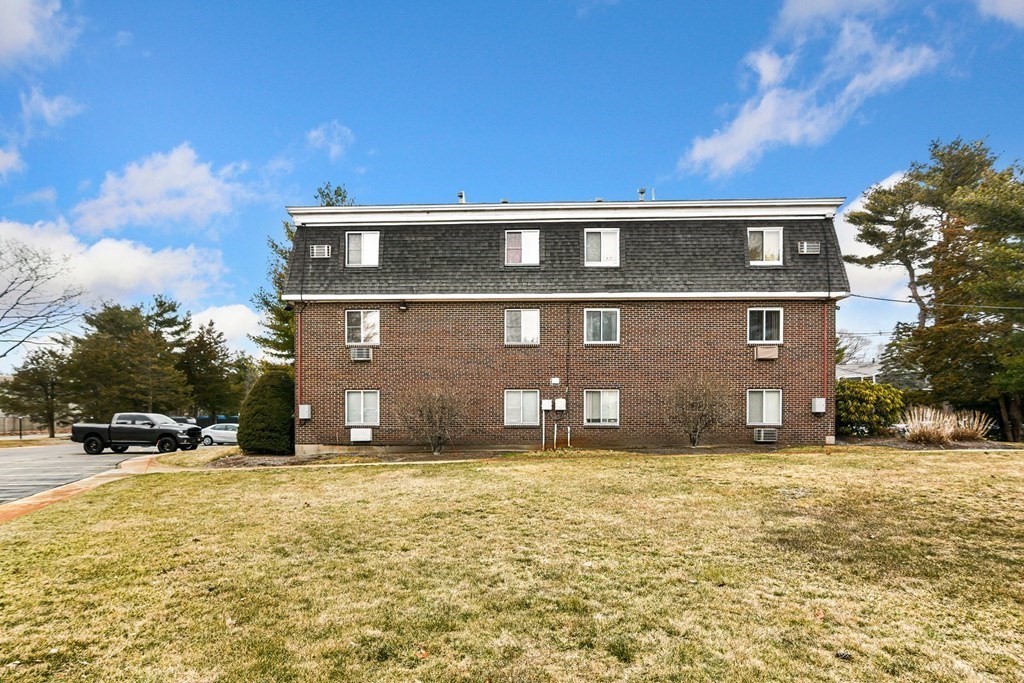 53 Will Drive, Unit 140 Canton, MA 02021 - Photo 20 of 22 a view of a house with a yard