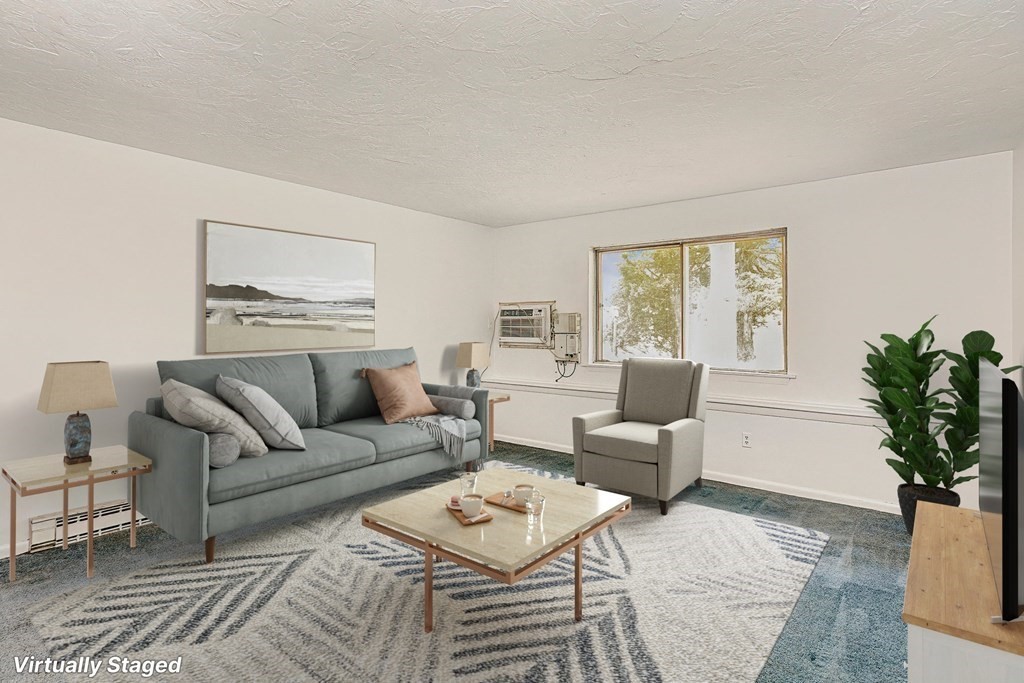 53 Will Drive, Unit 140 Canton, MA 02021 - Photo 2 of 22 a living room with furniture a potted plant and a window