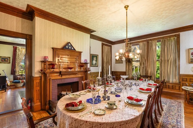 a dining room with furniture window and outdoor view