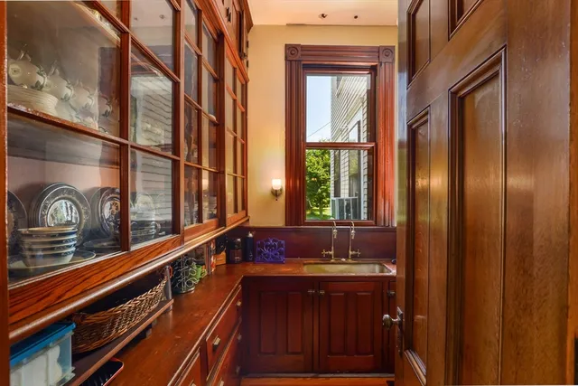 a bathroom with a sink and a large mirror