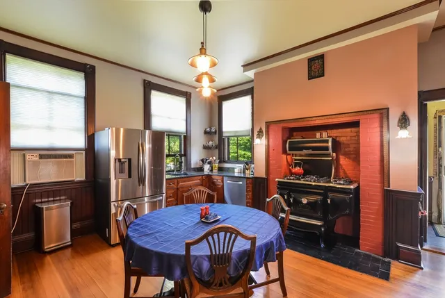 a view of a dining room with furniture window and wooden floor