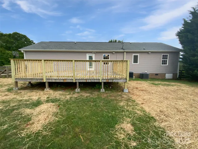 a view of a backyard with large trees