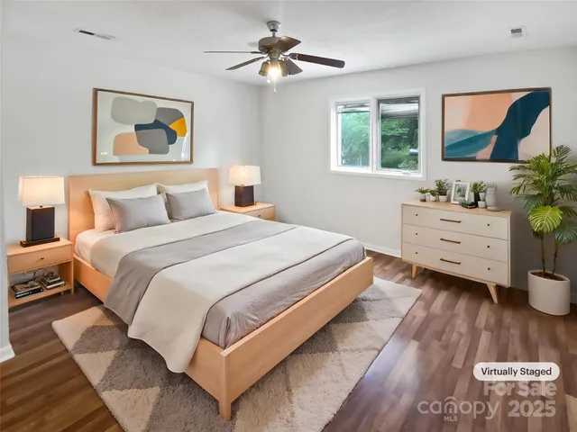 a bedroom with a bed and a dresser