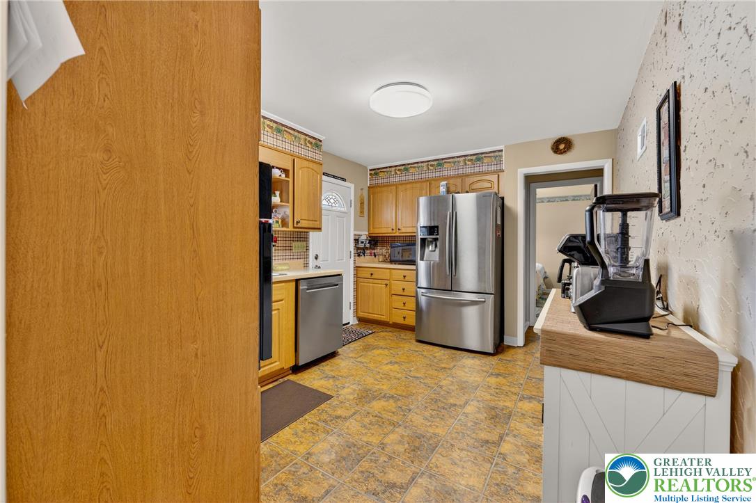 534 Seem Street Emmaus, PA 18049 - Photo 11 of 42 a kitchen with stainless steel appliances a refrigerator and a stove