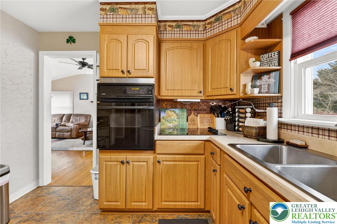 534 Seem Street Emmaus, PA 18049 - Photo 13 of 42 a kitchen with stainless steel appliances granite countertop a sink stove and cabinets