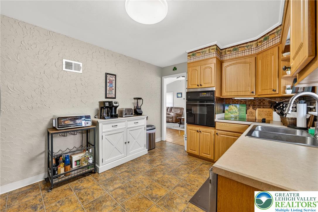 534 Seem Street Emmaus, PA 18049 - Photo 14 of 42 a kitchen with stainless steel appliances a stove and a refrigerator