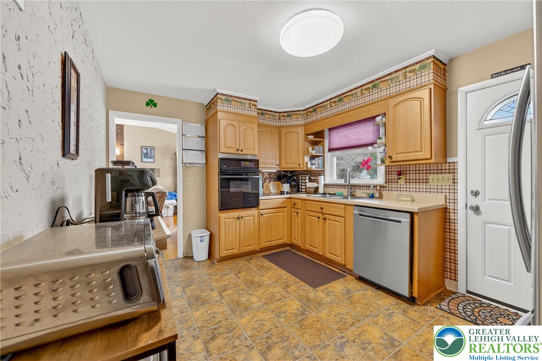 534 Seem Street Emmaus, PA 18049 - Photo 15 of 42 a kitchen with stainless steel appliances granite countertop a refrigerator sink and stove