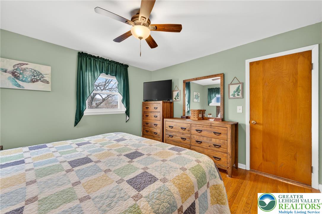 534 Seem Street Emmaus, PA 18049 - Photo 18 of 42 a bedroom with a bed and a chandelier