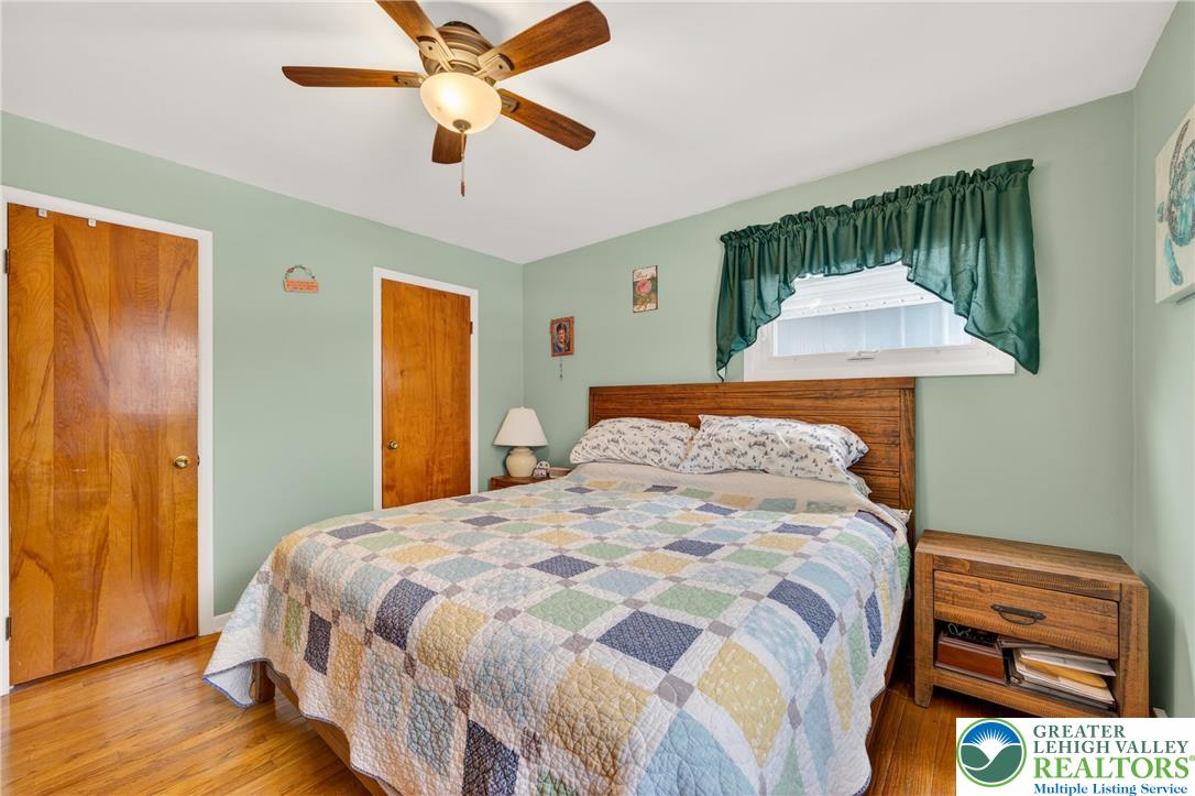 534 Seem Street Emmaus, PA 18049 - Photo 19 of 42 a bedroom with a bed and a chandelier