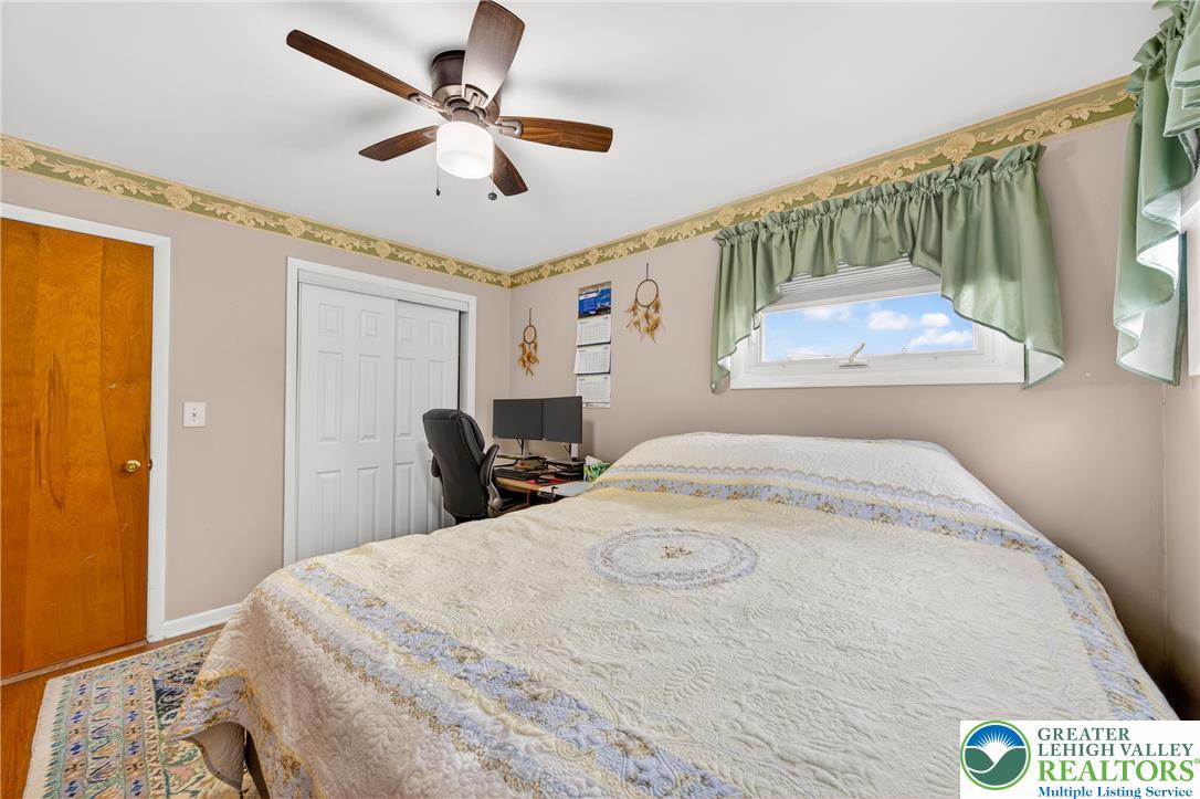 534 Seem Street Emmaus, PA 18049 - Photo 23 of 42 a bedroom with a bed and a chandelier