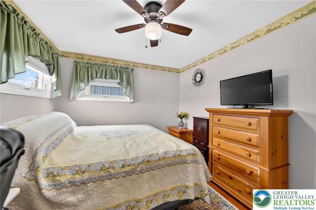 534 Seem Street Emmaus, PA 18049 - Photo 24 of 42 a bedroom with a bed and a flat screen tv