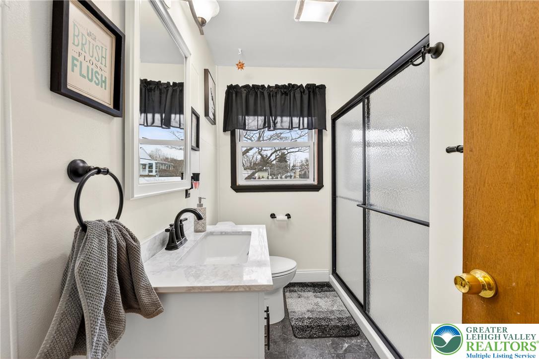 534 Seem Street Emmaus, PA 18049 - Photo 25 of 42 a bathroom with a sink and mirror with bathtub