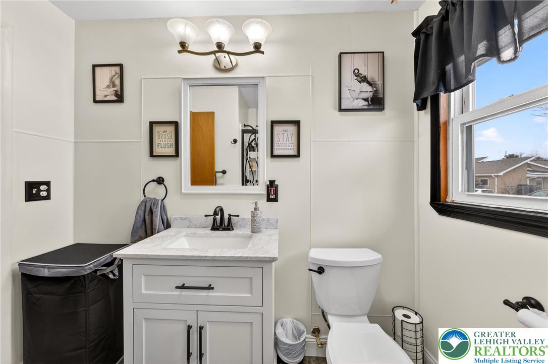 534 Seem Street Emmaus, PA 18049 - Photo 26 of 42 a bathroom with a toilet a sink and mirror