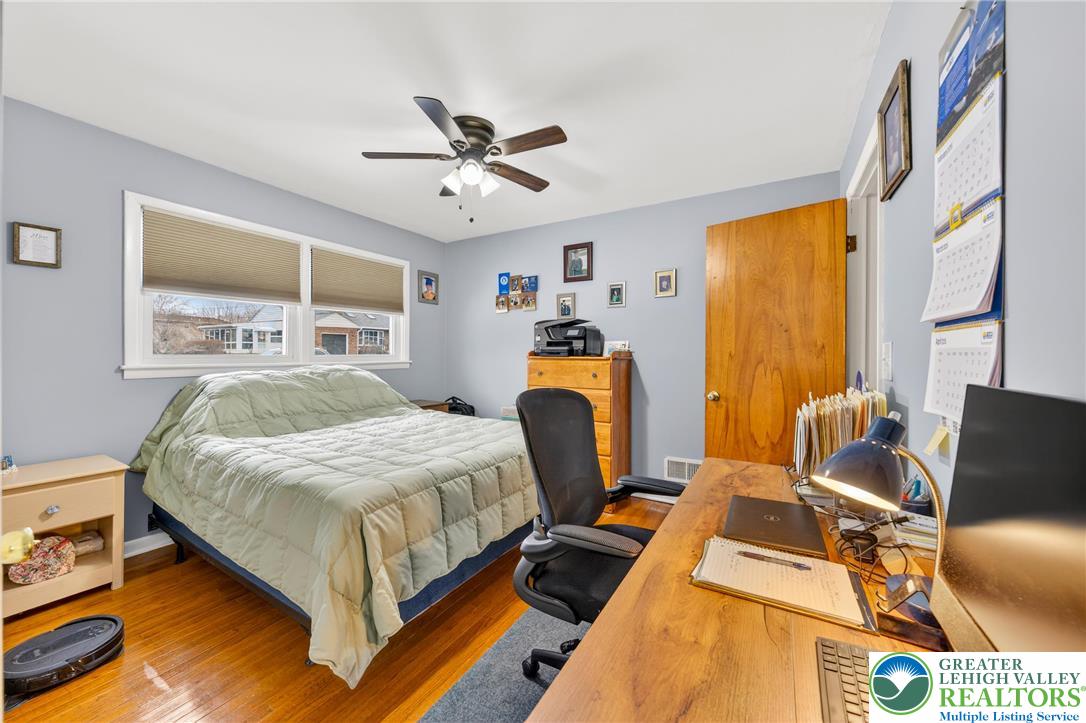 534 Seem Street Emmaus, PA 18049 - Photo 27 of 42 a bedroom with a bed a couch and a chandelier