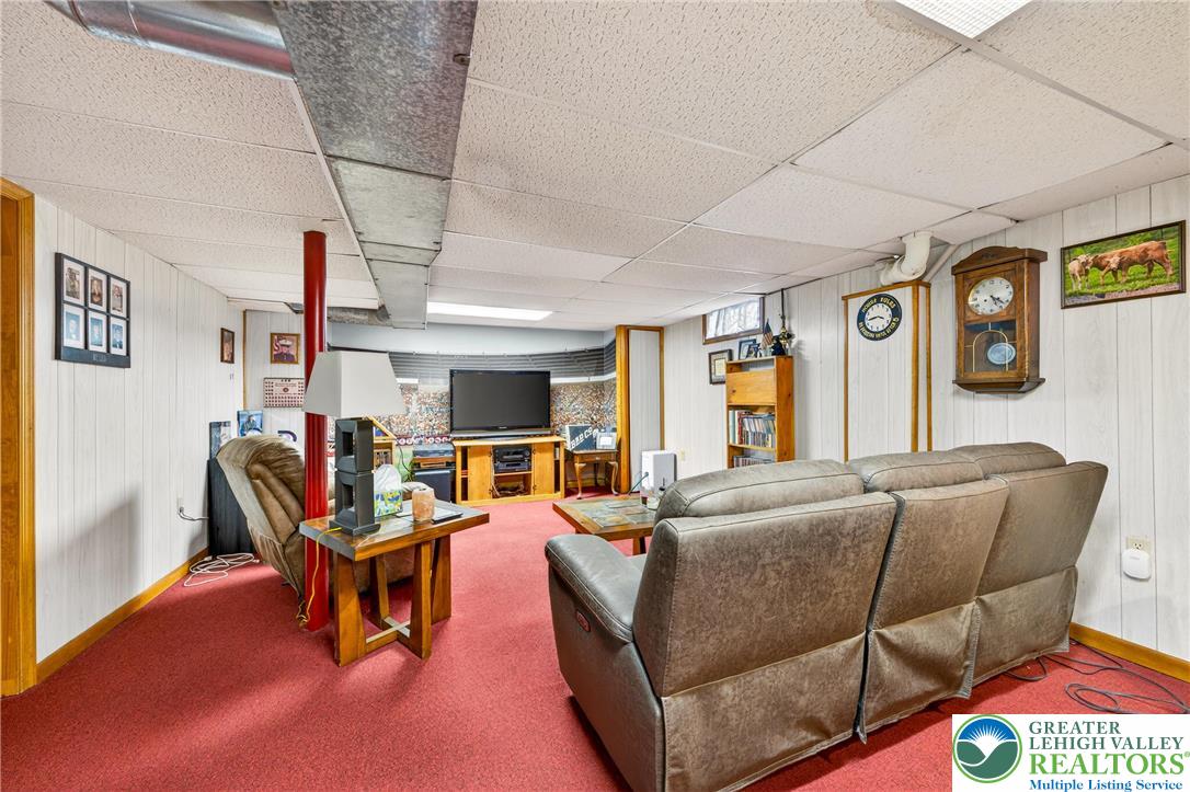534 Seem Street Emmaus, PA 18049 - Photo 34 of 42 a living room with furniture a flat screen tv and kitchen view