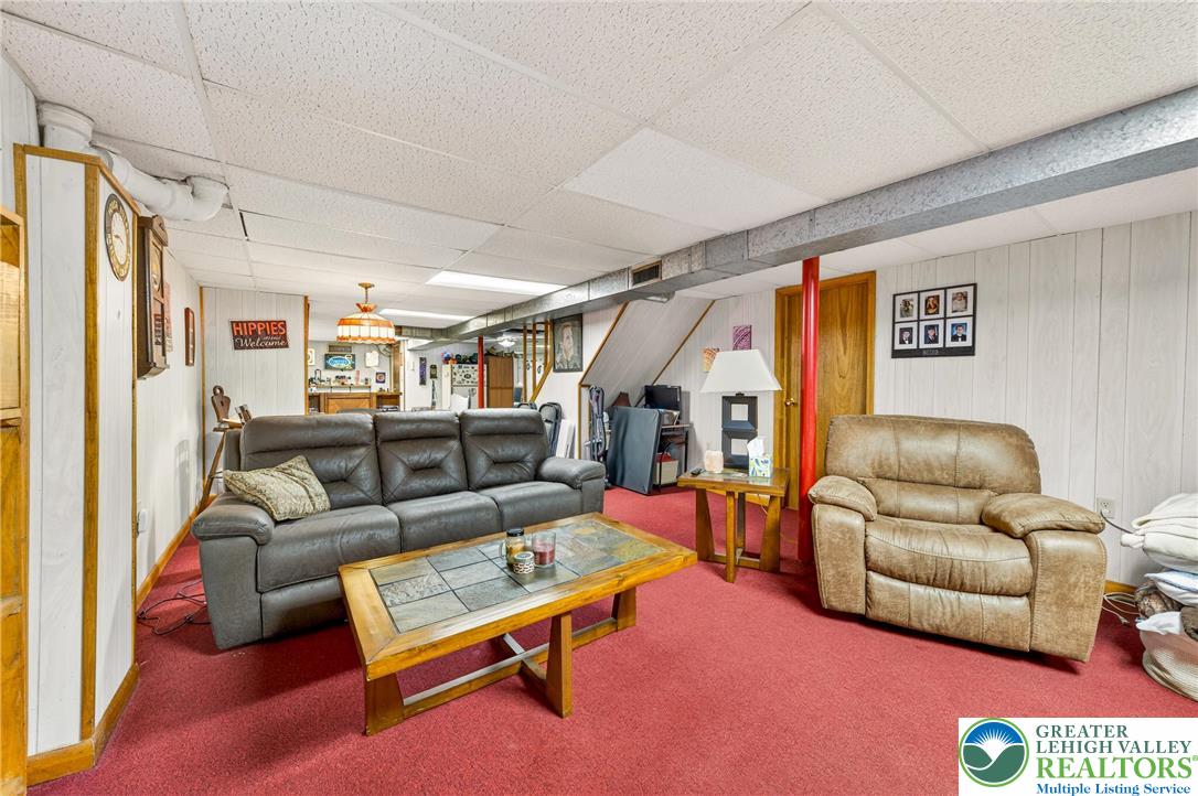 534 Seem Street Emmaus, PA 18049 - Photo 35 of 42 a living room with furniture a rug and a couch