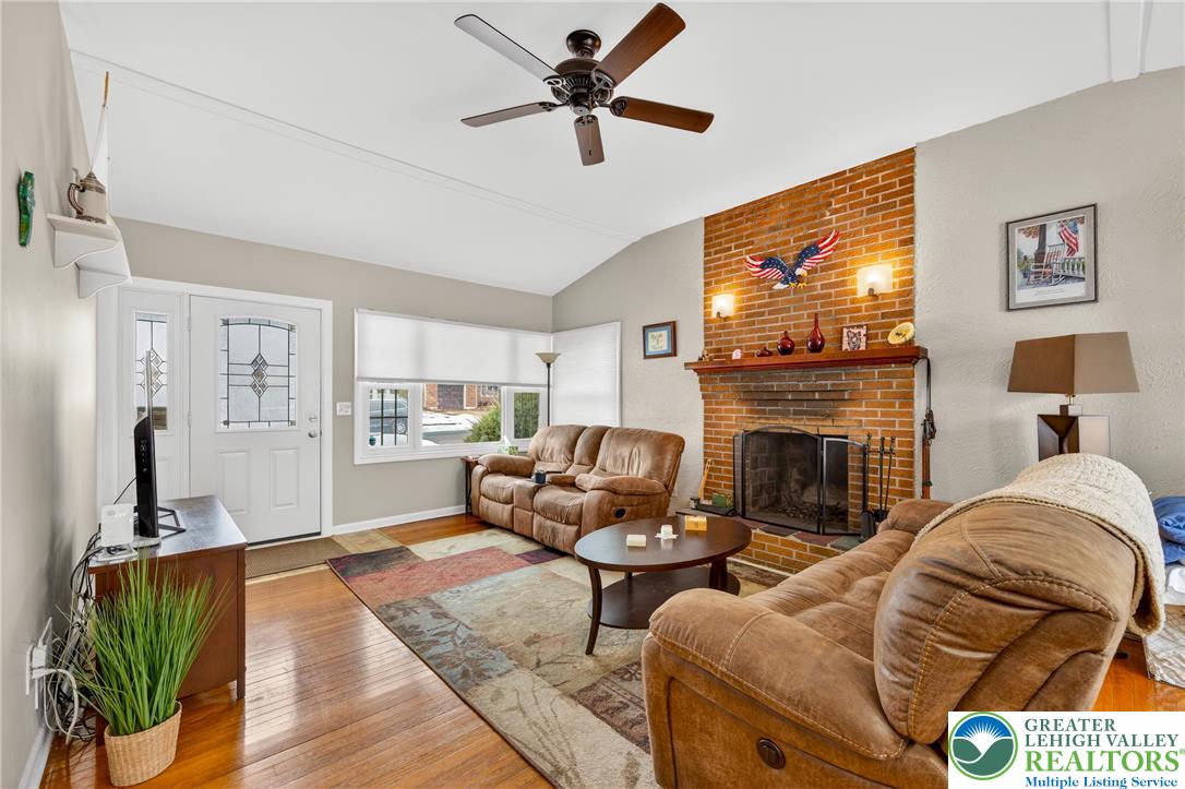534 Seem Street Emmaus, PA 18049 - Photo 7 of 42 a living room with furniture a flat screen tv and a fireplace