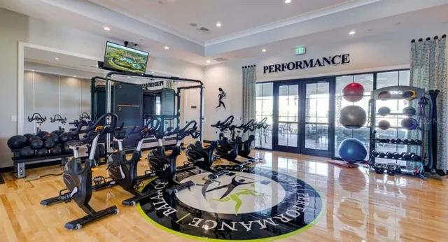 a view of a lake with a table and chairs