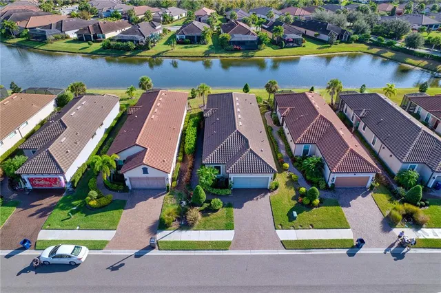 an aerial view of house with yard swimming pool and outdoor seating