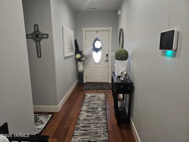 a kitchen with a table chairs and a refrigerator