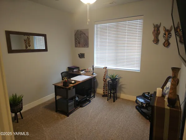 a bedroom with bed and window