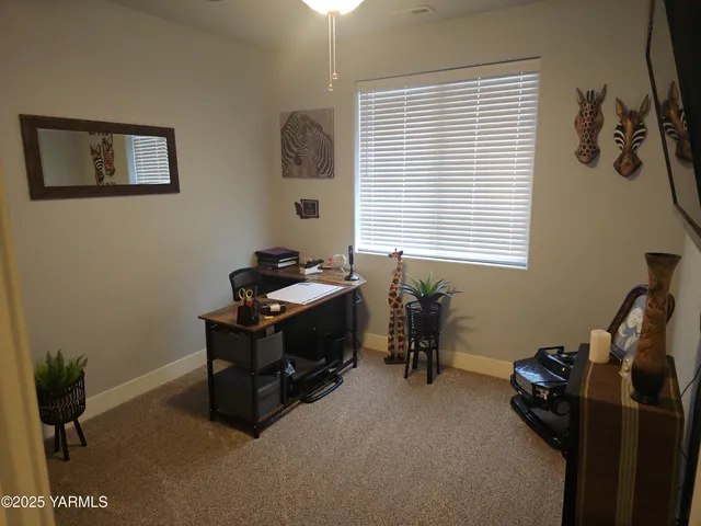 a bedroom with bed and window