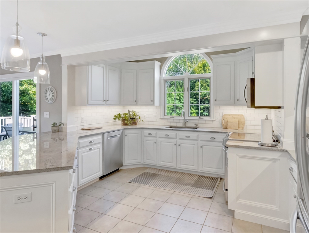 1620 West Street Wrentham, MA 02093 - Photo 3 of 42 a kitchen with white cabinets and white appliances