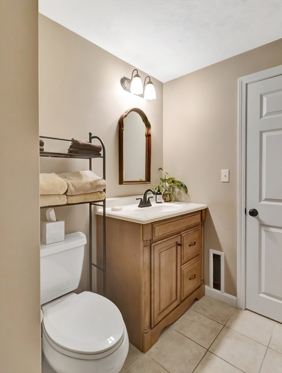 1620 West Street Wrentham, MA 02093 - Photo 35 of 42 a bathroom with a sink toilet and vanity