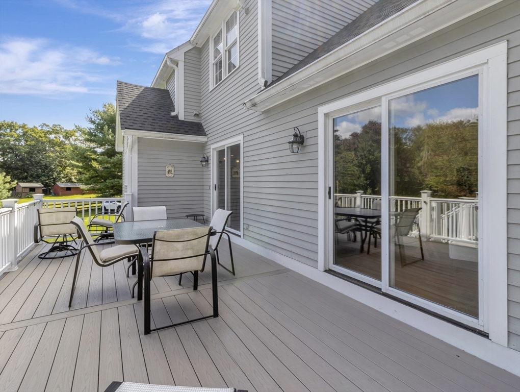1620 West Street Wrentham, MA 02093 - Photo 36 of 42 a view of a patio with table and chairs