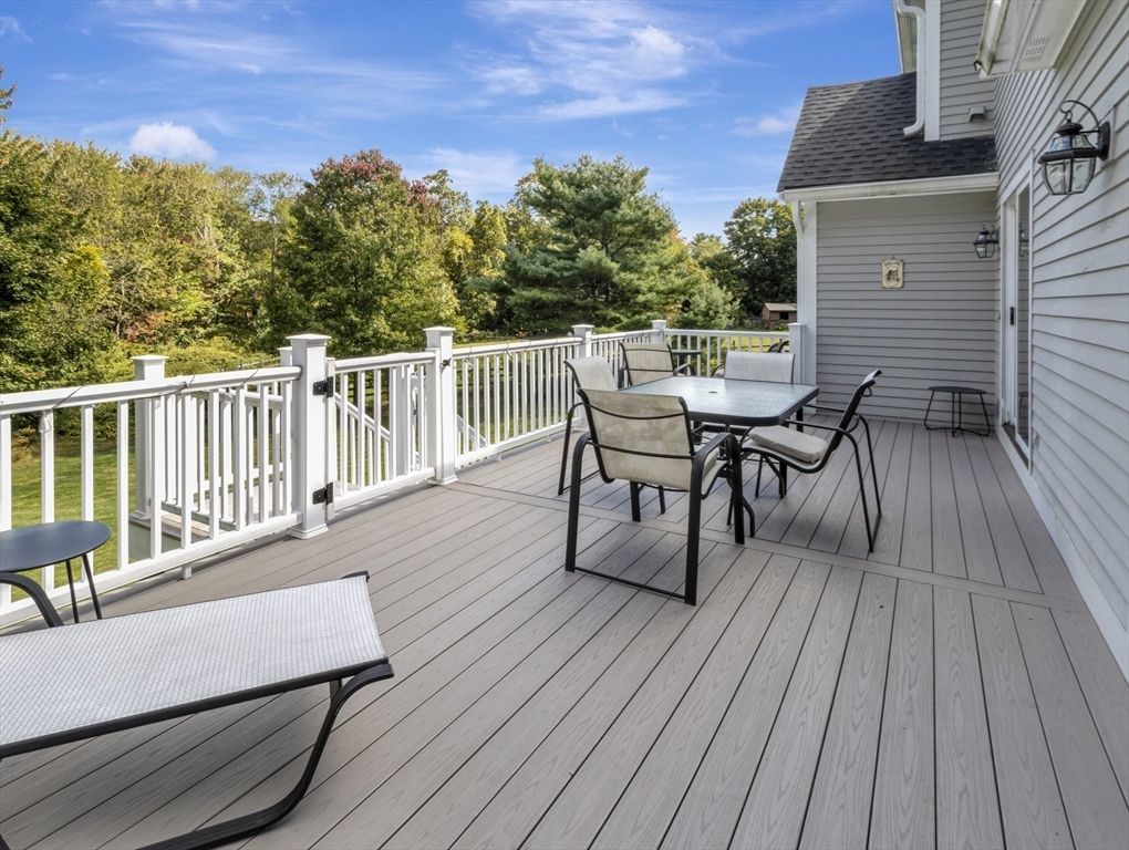 1620 West Street Wrentham, MA 02093 - Photo 37 of 42 a view of a roof deck with table and chairs