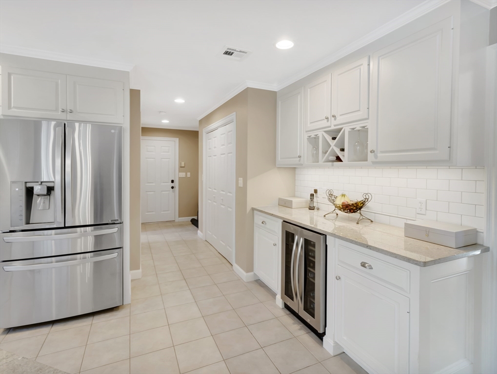 1620 West Street Wrentham, MA 02093 - Photo 5 of 42 a kitchen with stainless steel appliances a stove refrigerator sink and cabinets