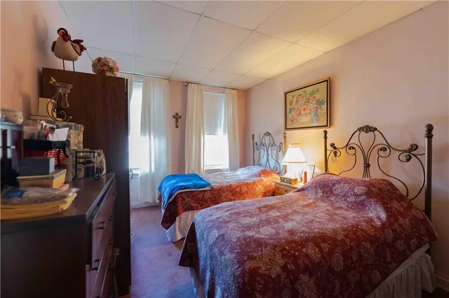 a bedroom with bed and a window