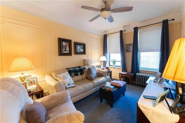 a living room with furniture and a window