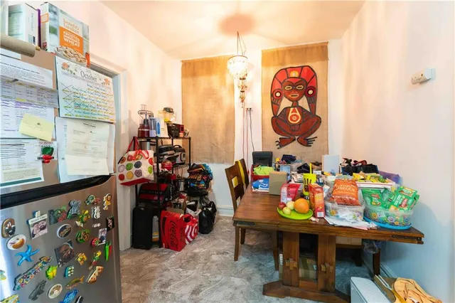 a view of a room with lots of gym equipment