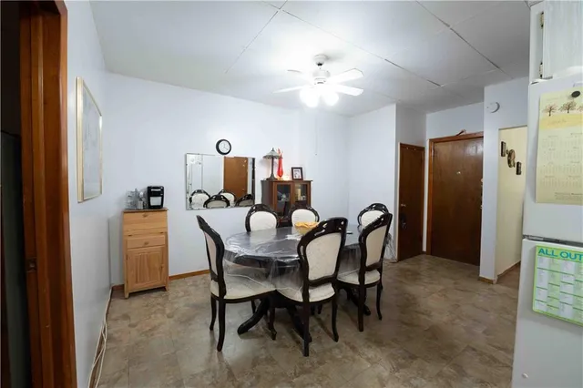 a dining room with furniture and chandelier