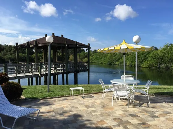a view of a chair and tables in the patio