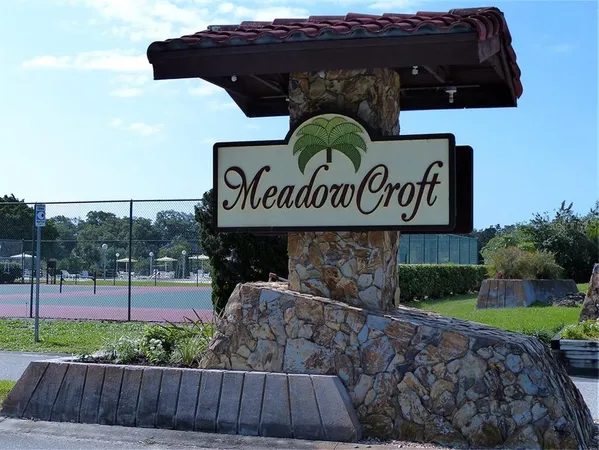 a view of outdoor space with signage and flags