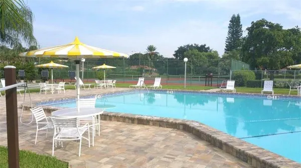 a view of a swimming pool with a patio