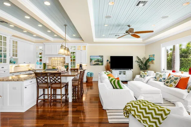 a kitchen with a sink and a wooden floor