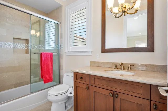 an aerial view of residential houses with outdoor space and river view