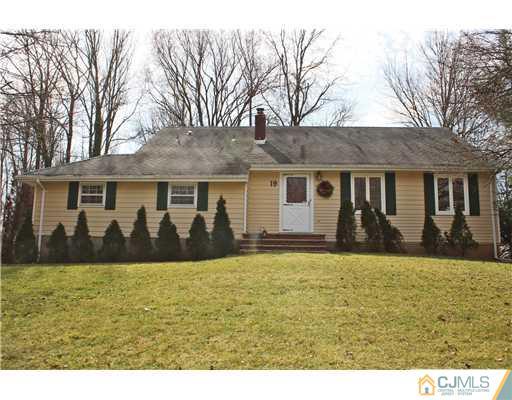 19 Timber Road Edison, NJ 08820 - Photo 1 of 25 a front view of a house with yard and trees