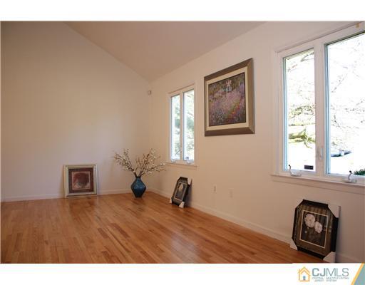 19 Timber Road Edison, NJ 08820 - Photo 2 of 25 a view of empty room with window and wooden floor